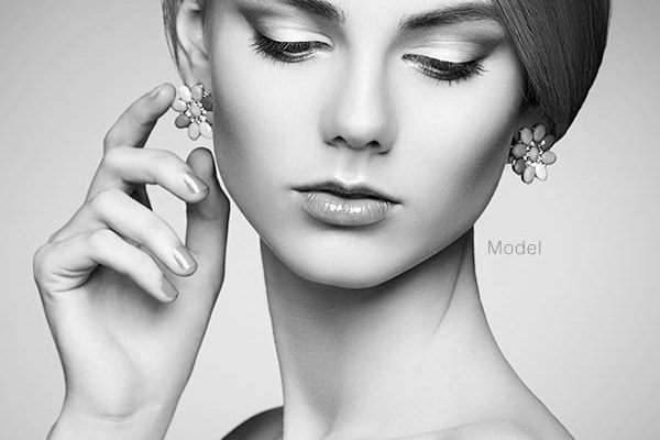 Woman touching earring