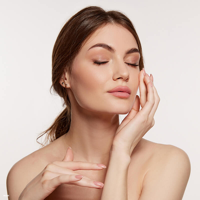 Brown haired woman with her eyes closed