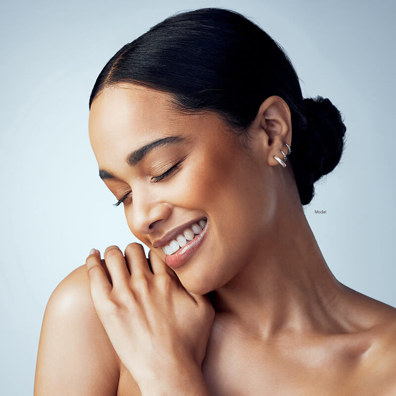 Woman with her head down and eyes closed