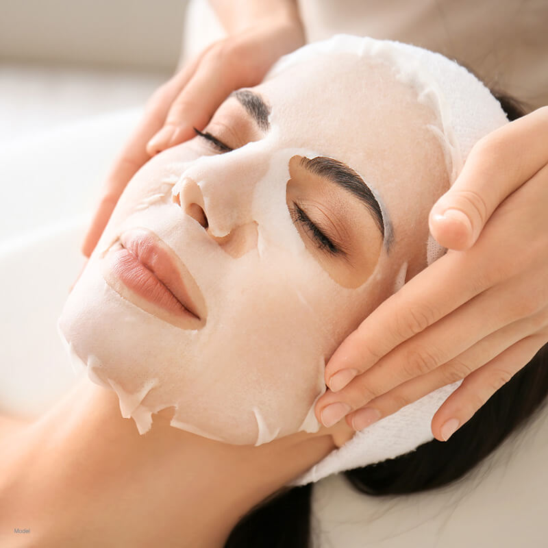 Woman with a gel face mask on