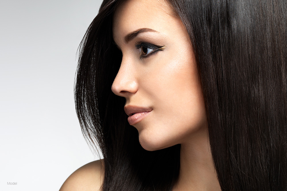 Profile of a young woman with black hair