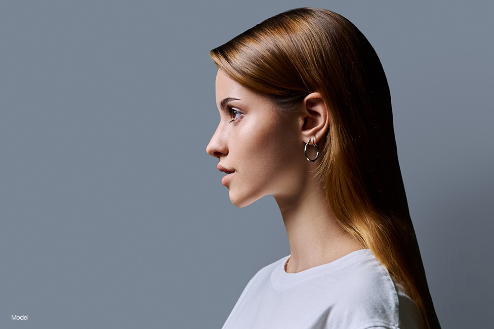 Profile of a young woman in a white t-shirt