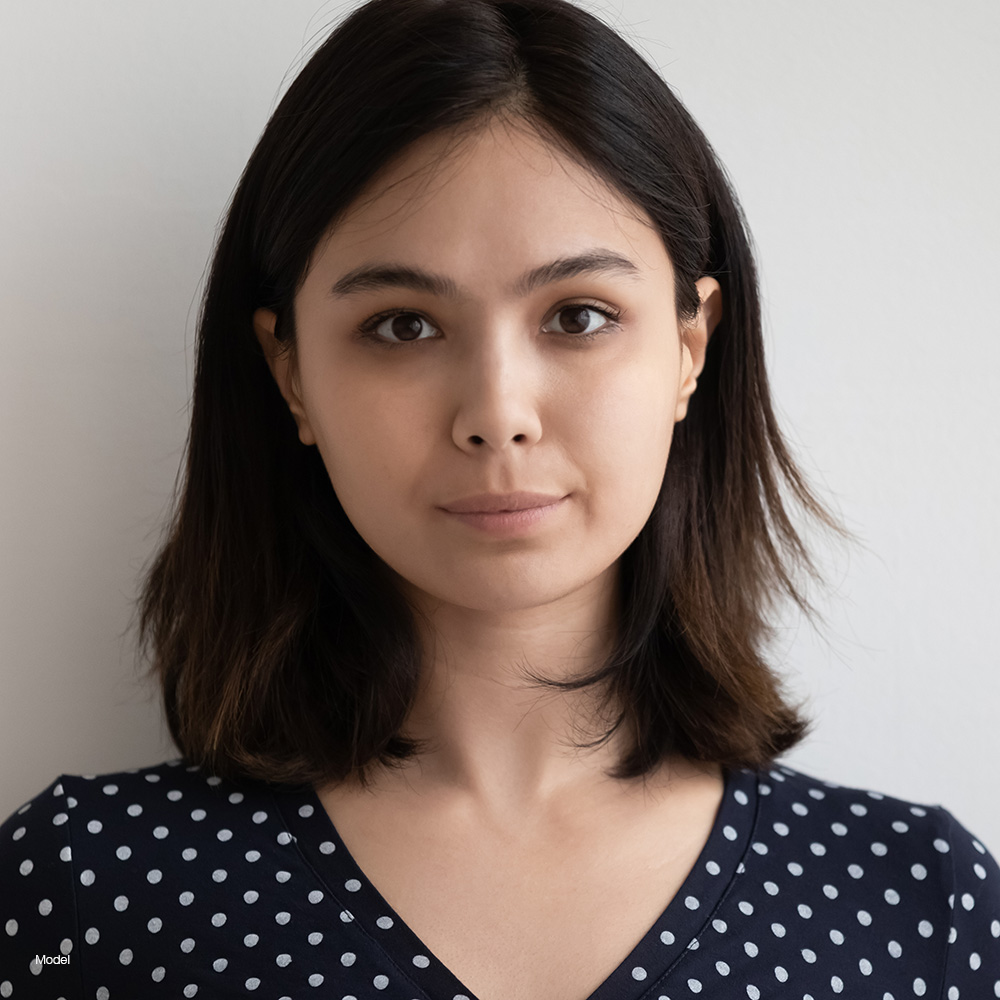 Woman with short hair in a polkadot shirt