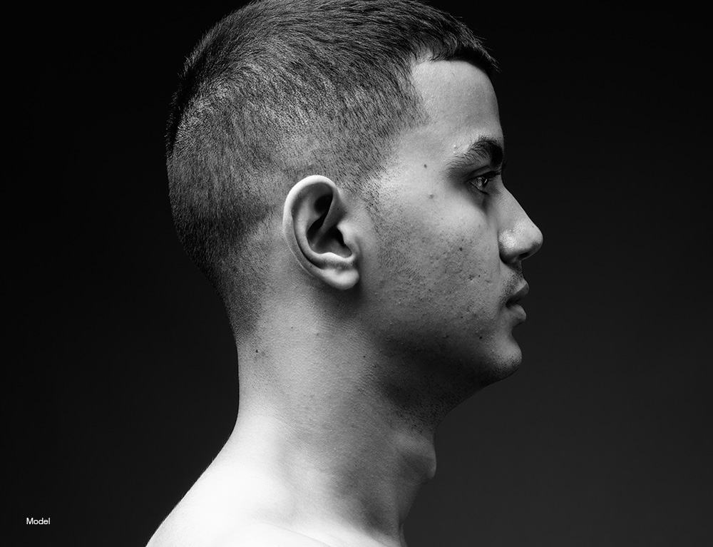 Profile of a young man with short hair